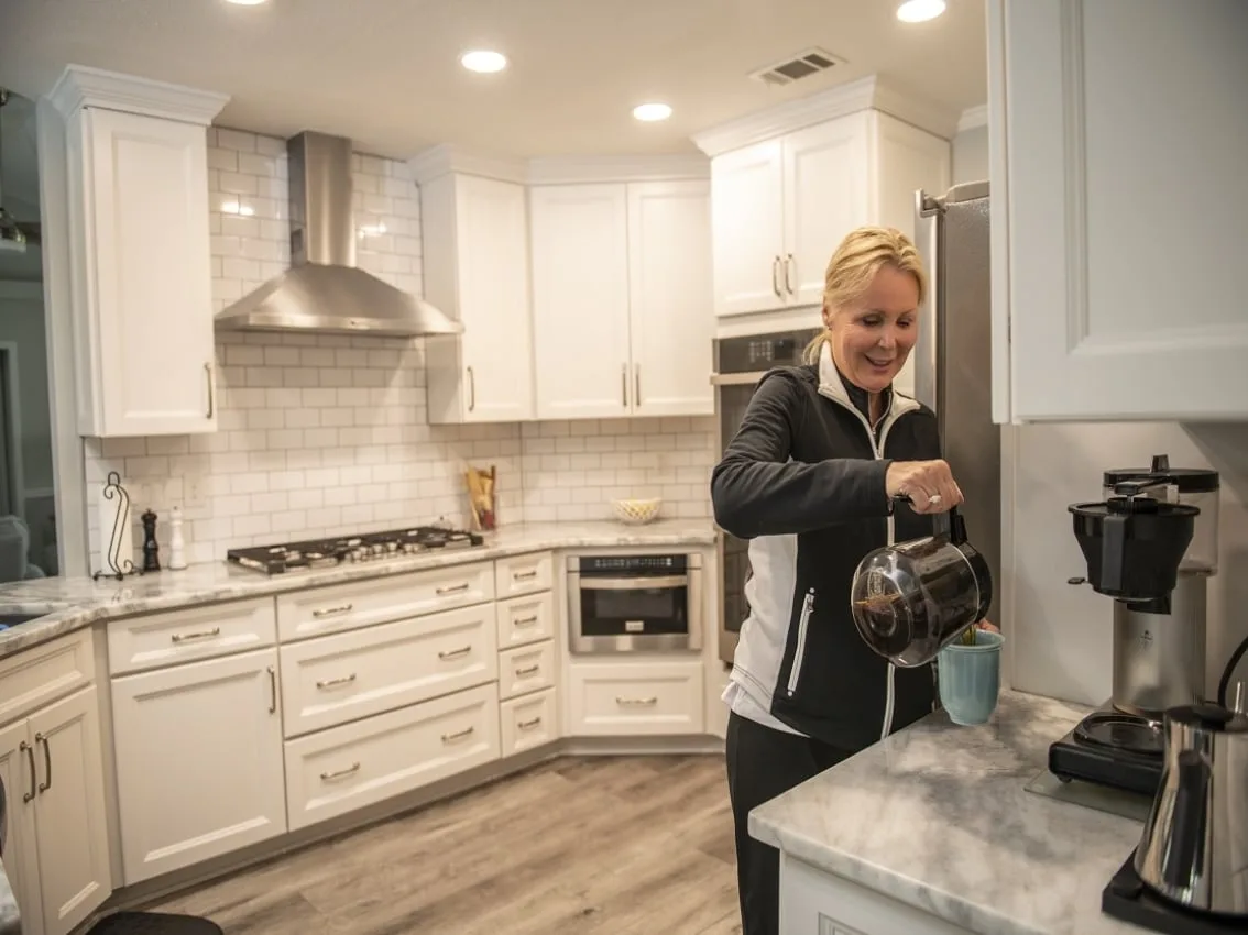 Homeowner making coffee during an outage with Cummins standby power